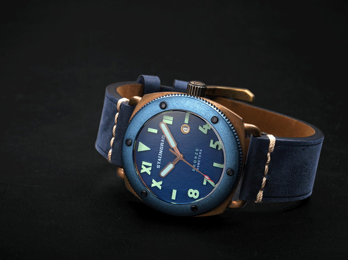 Stalingrad Bronze 200m water resistance watch blue dial and blue leather strap on a black surface