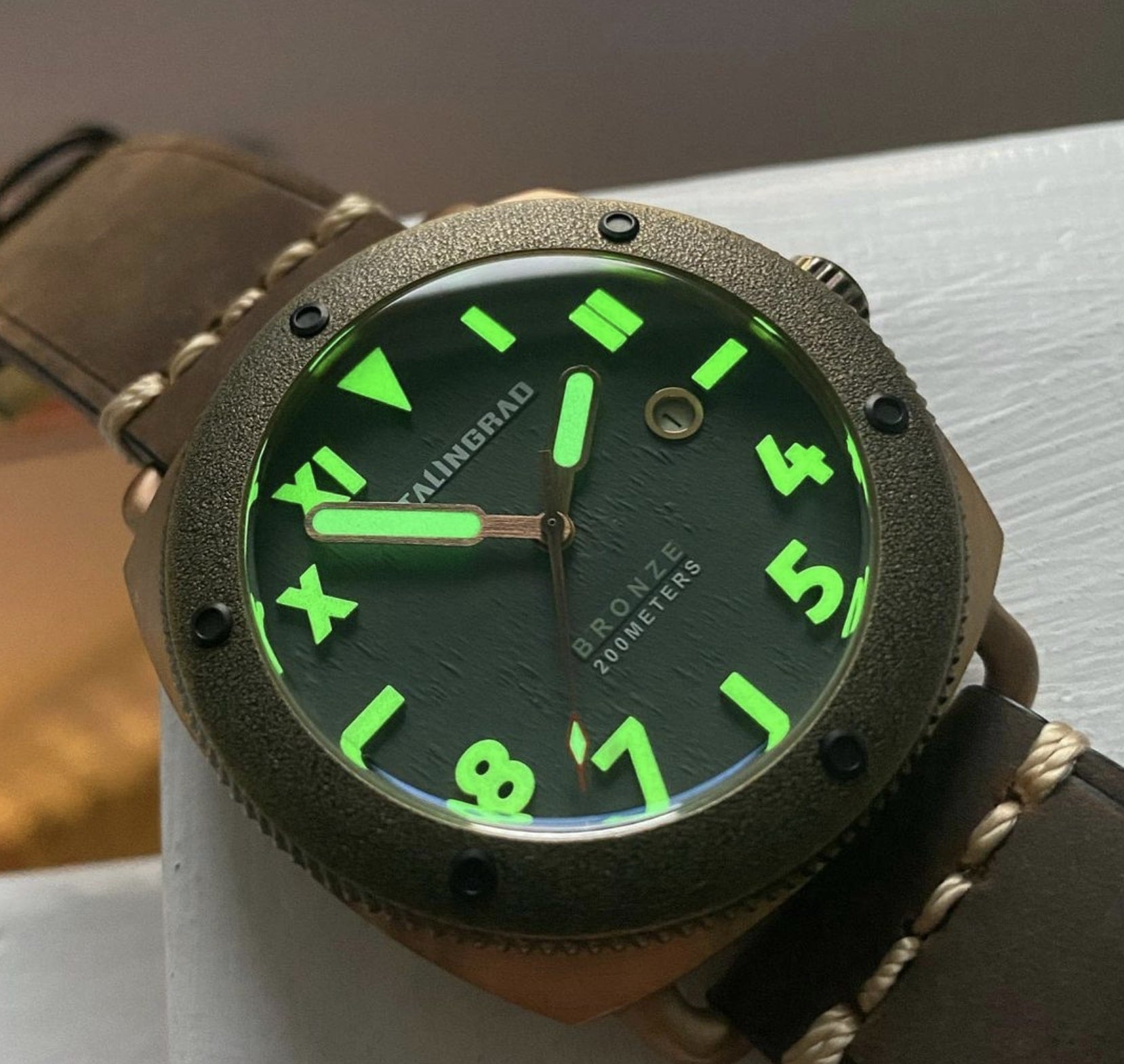 Defender 200m Bronze watch green dial showing Lume 