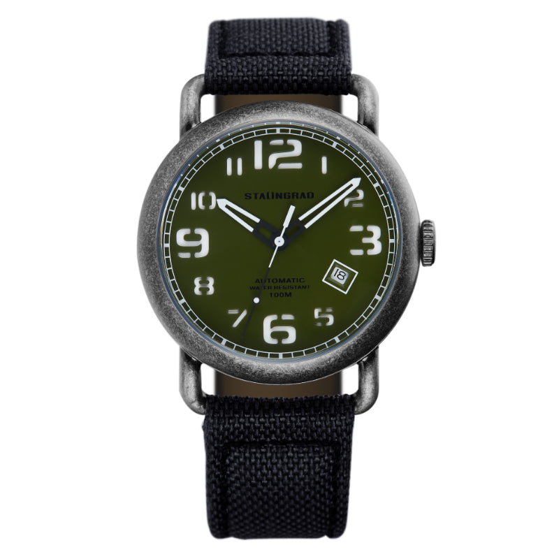 Stalingrad Rodim Watch with a sandwich dial. Green dial with White hand and numbers, Silver case and a black cordura strap front view of watch on white background.