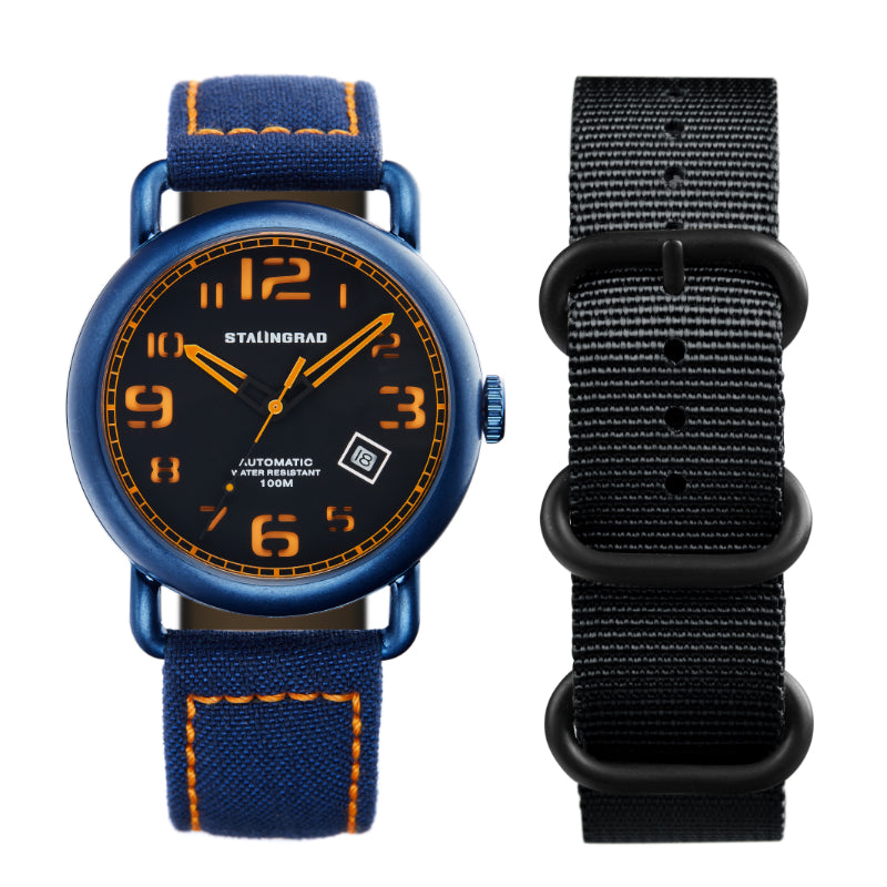 Stalingrad Rodim Watch with a sandwich dial. Black and orange dial, blue case and a blue cordura strap, with a black nato strap on the right side  on w white background.